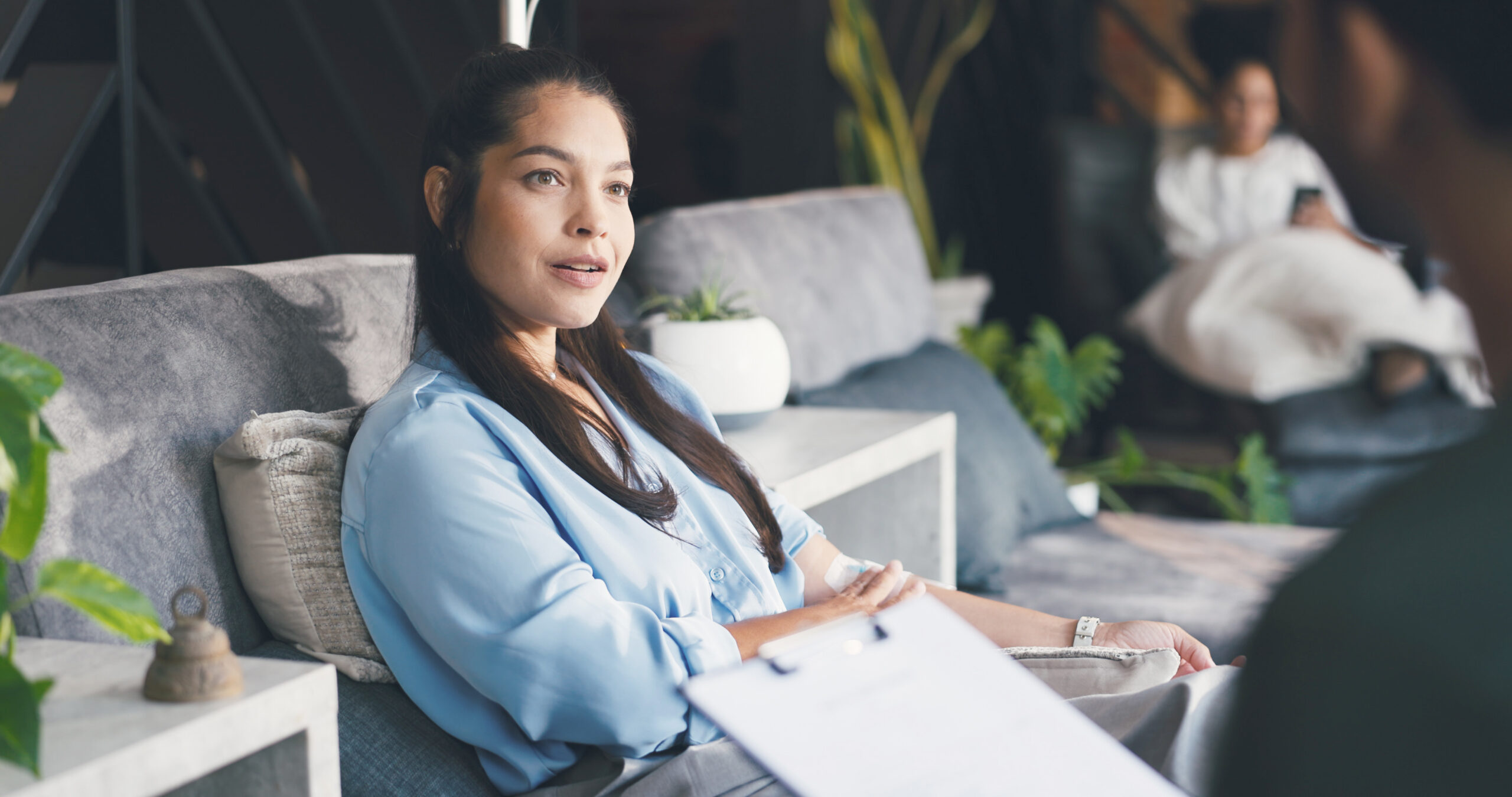 Woman, health policy or regulations with clipboard for IV drip, healthcare nutrition or service. Female person, customer or client with nurse for vitamin checkup or immunity booster therapy in clinic